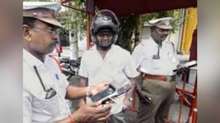 Techie goes to confirm with traffic cops if all documents are ok before actually bringing out his bike from home